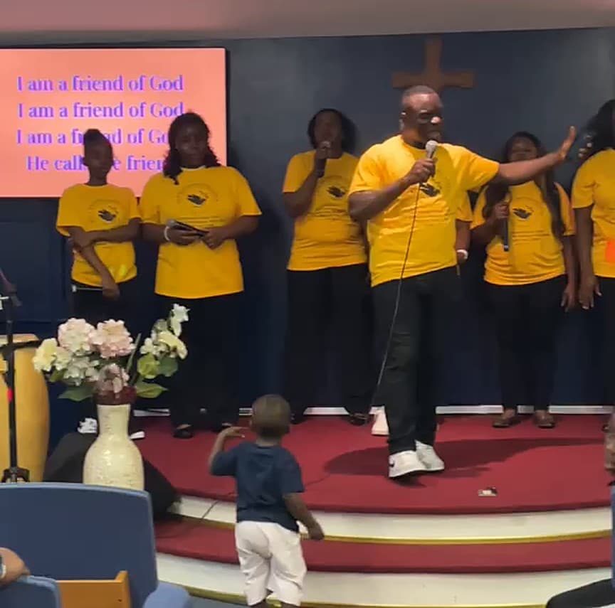 A choir member singing praise