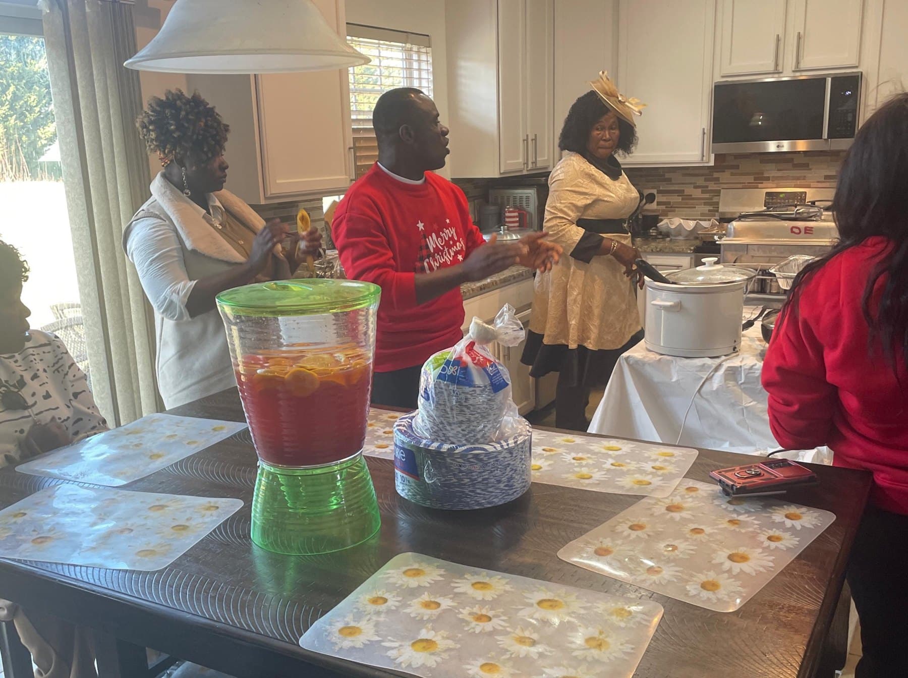 The church family gathered in the kitchen for Christmas fellowship