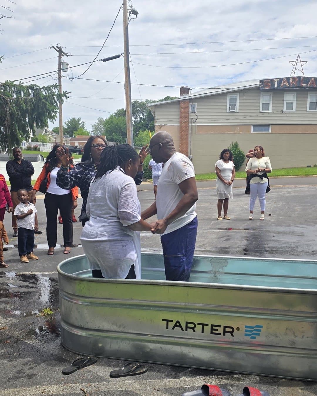 A baptism service outside the church