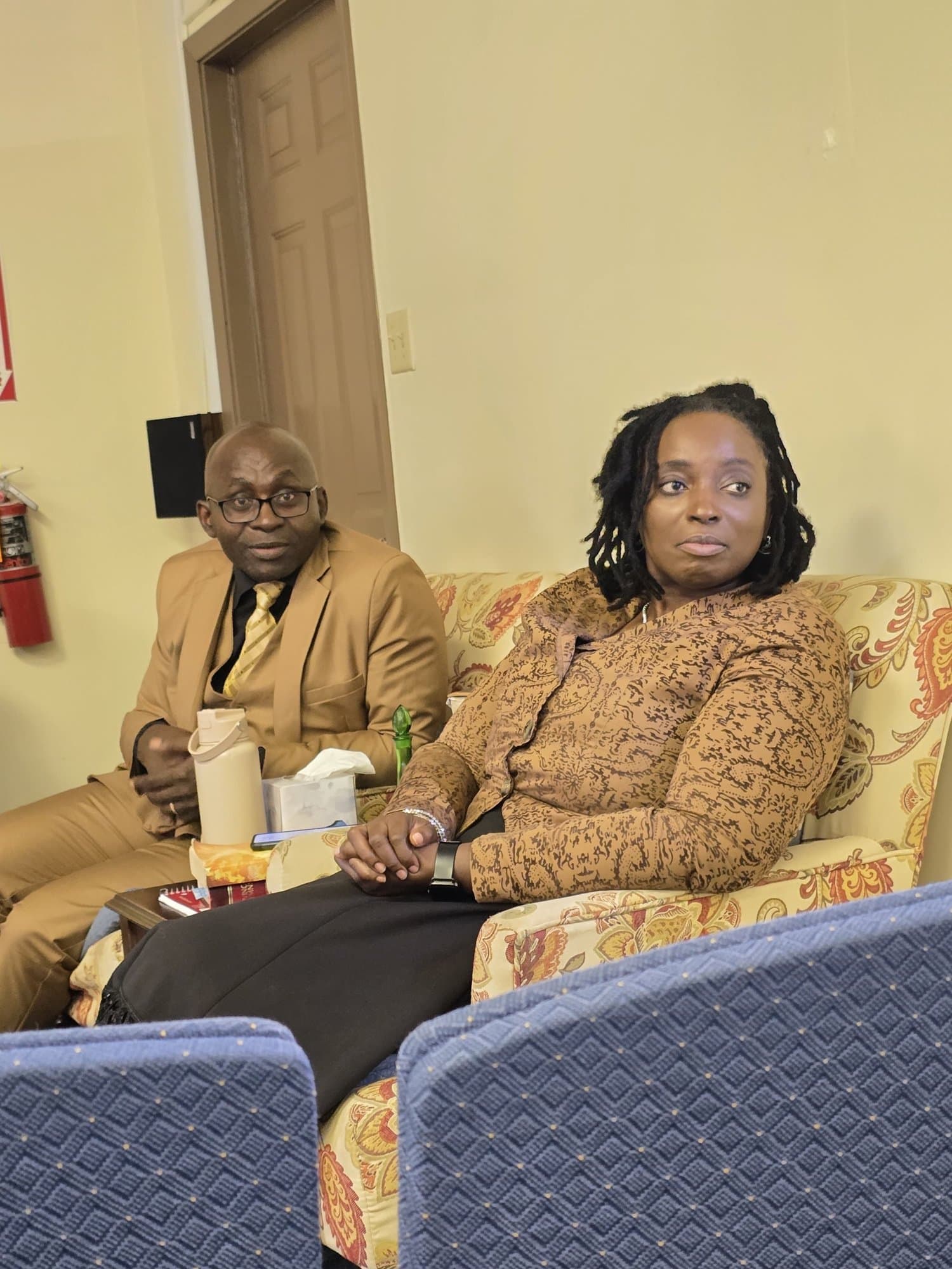 Pastor Reuben and Apostle Osla listening during Bible study